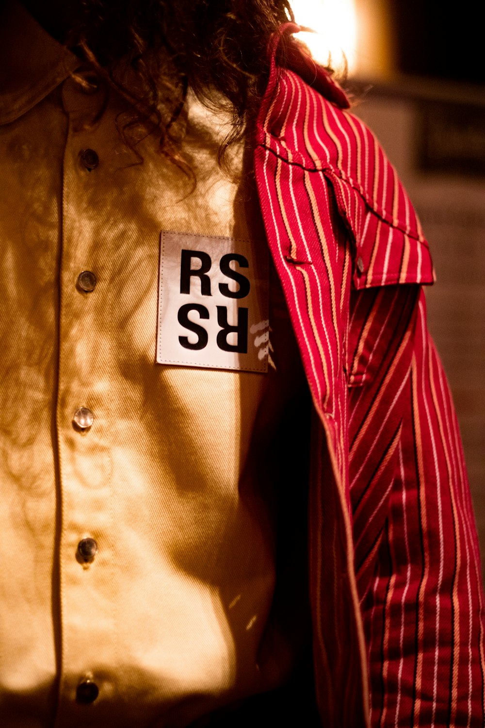 woman in red and white striped button up shirt