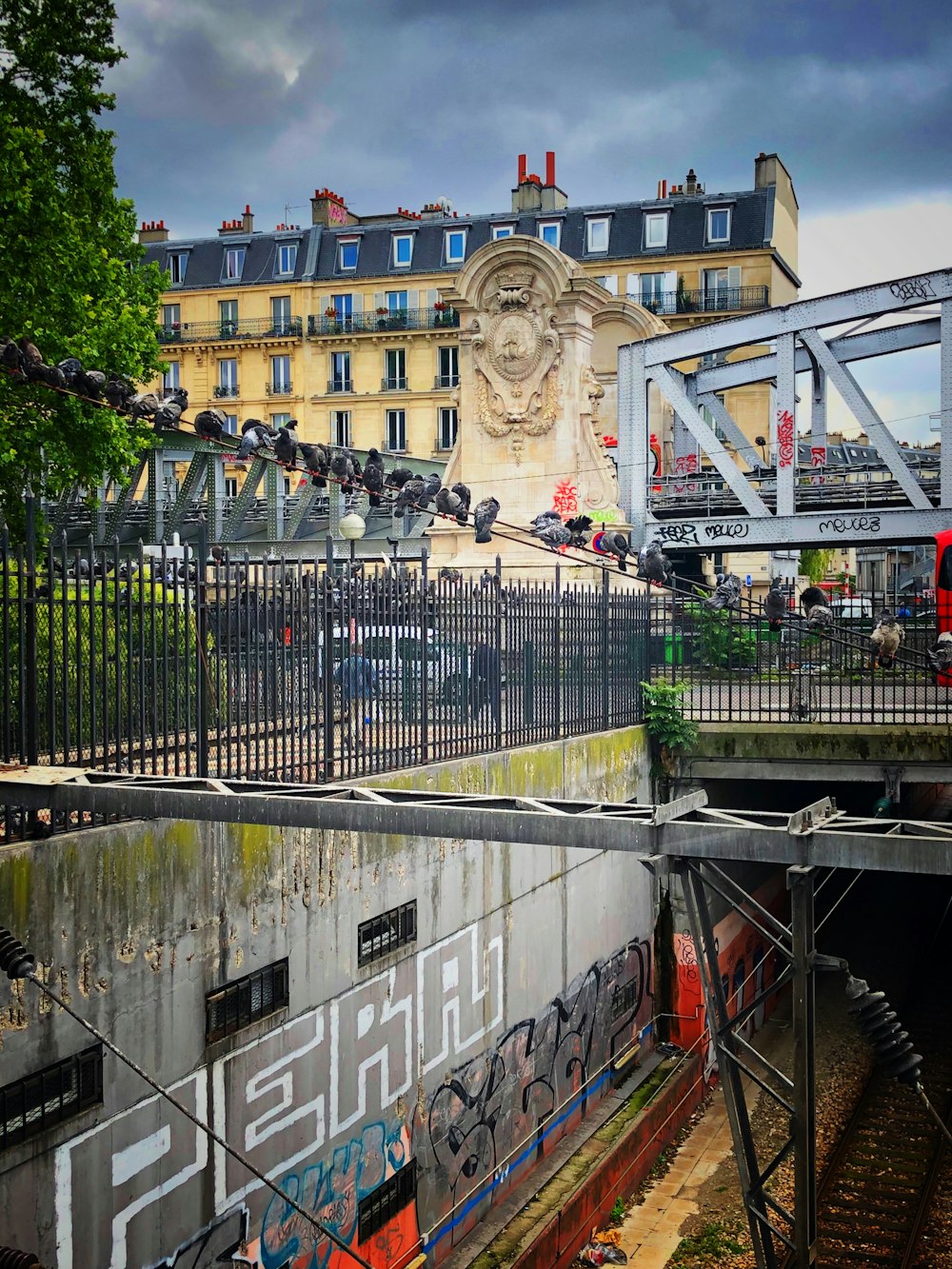 people walking on bridge near building during daytime