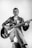 man in black leather jacket playing electric guitar