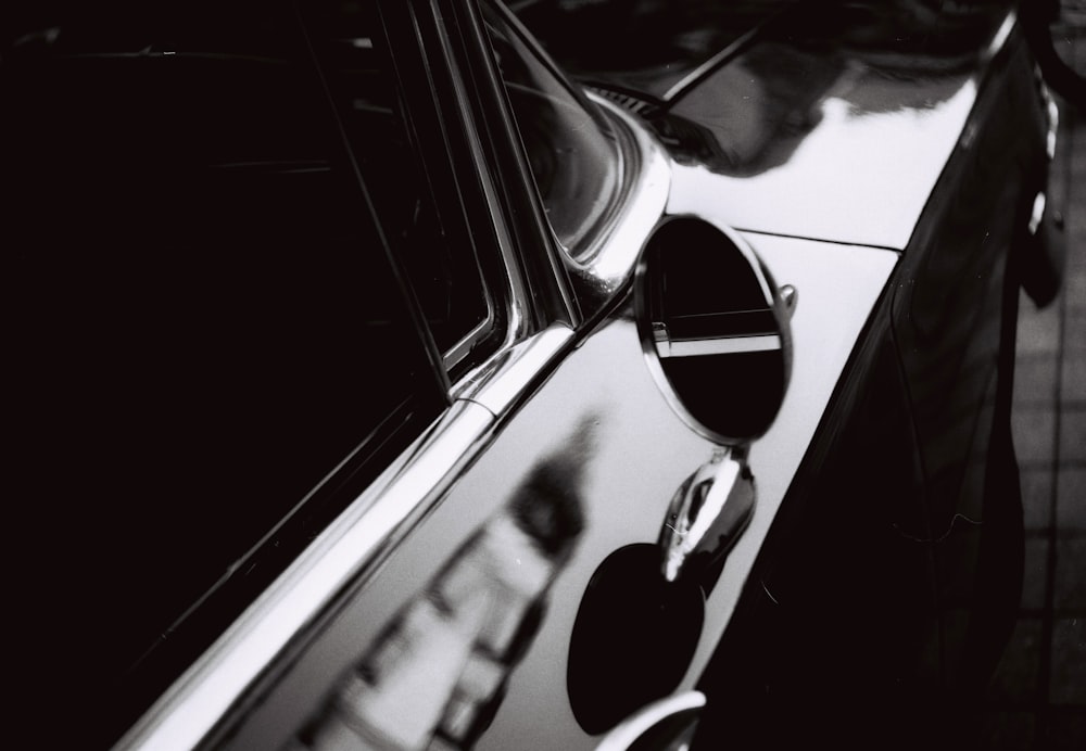 grayscale photo of car door