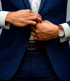 man in blue suit jacket and white dress shirt