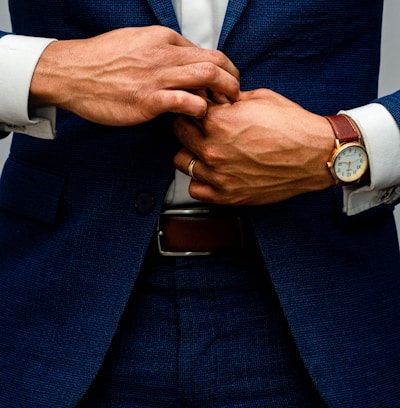 man in blue suit jacket and white dress shirt