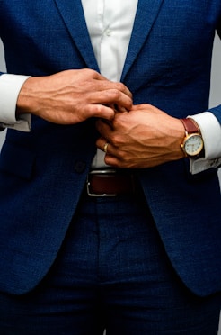 man in blue suit jacket and white dress shirt