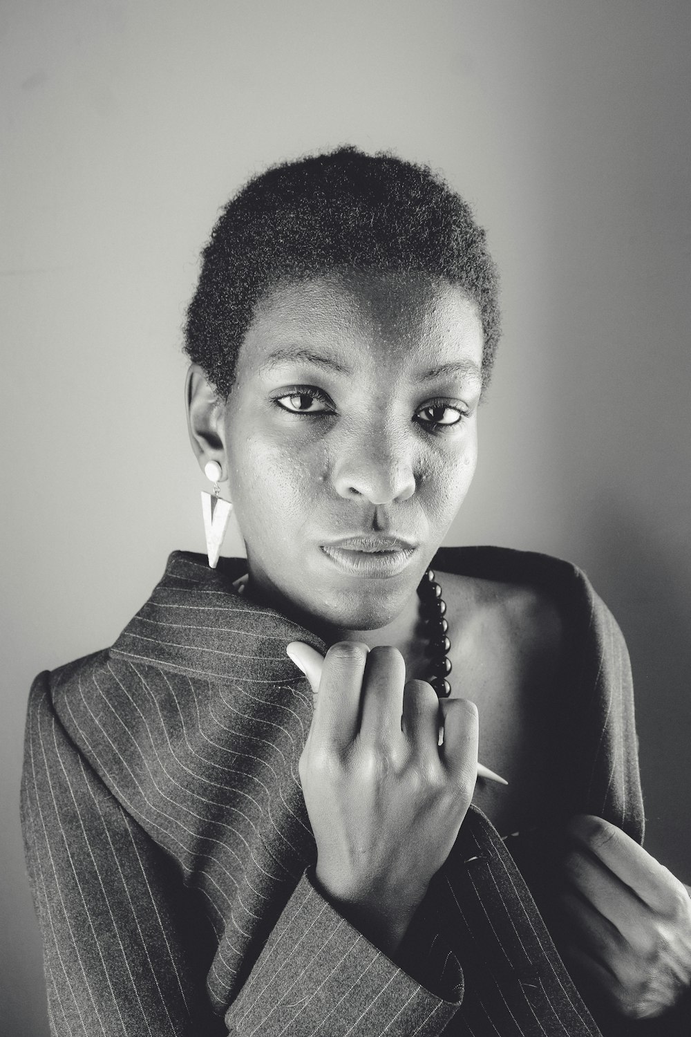 grayscale photo of woman in black blazer