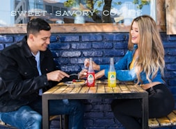 man and woman sitting at table