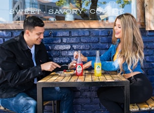 man and woman sitting at table