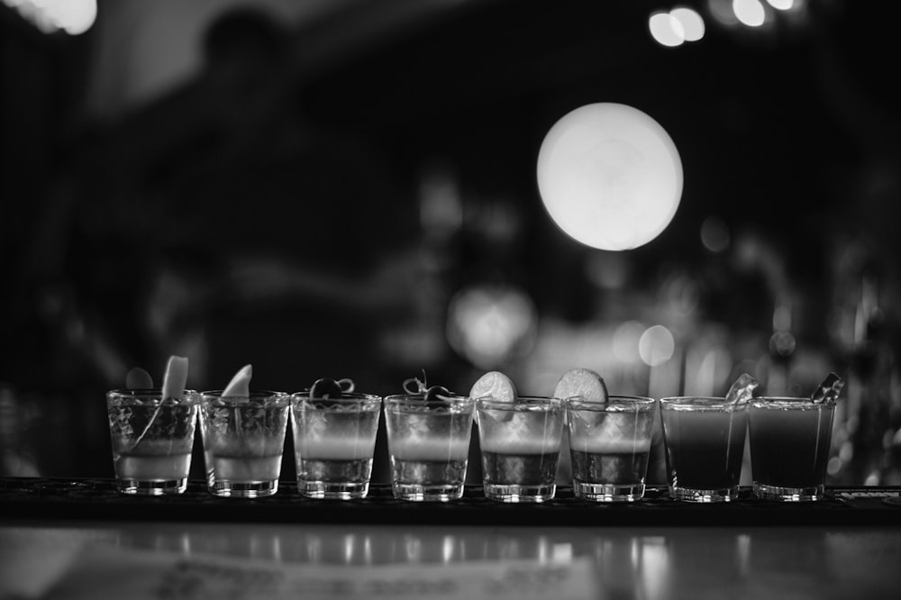 clear drinking glasses on black table