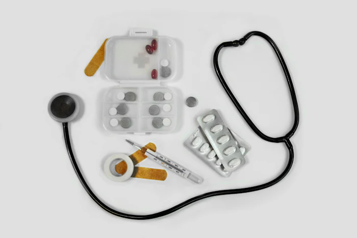 Medical instruments laid out on a white surface