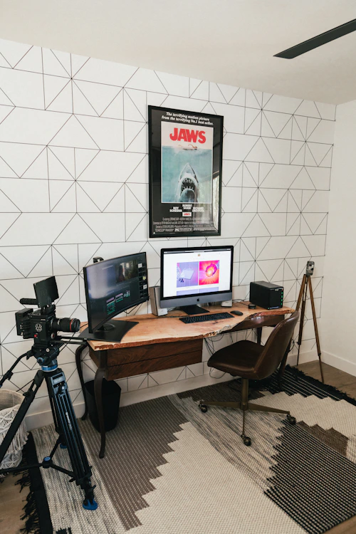 Creator workspace setup with monitor, keyboard and equipment
