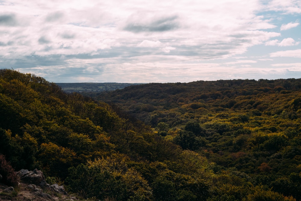 green and brown mountains under white clouds during daytime