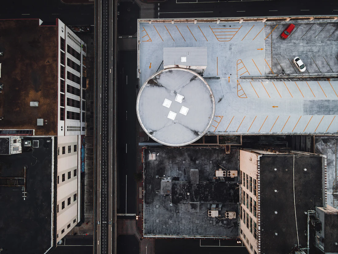 Top-down aerial of commercial building rooftops and HVAC units