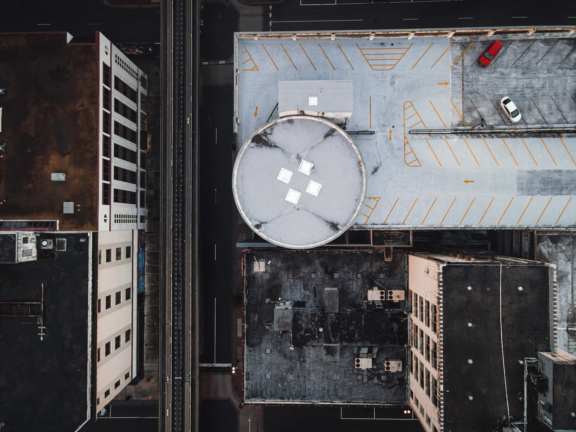 Top-down aerial of commercial building rooftops and HVAC equipment