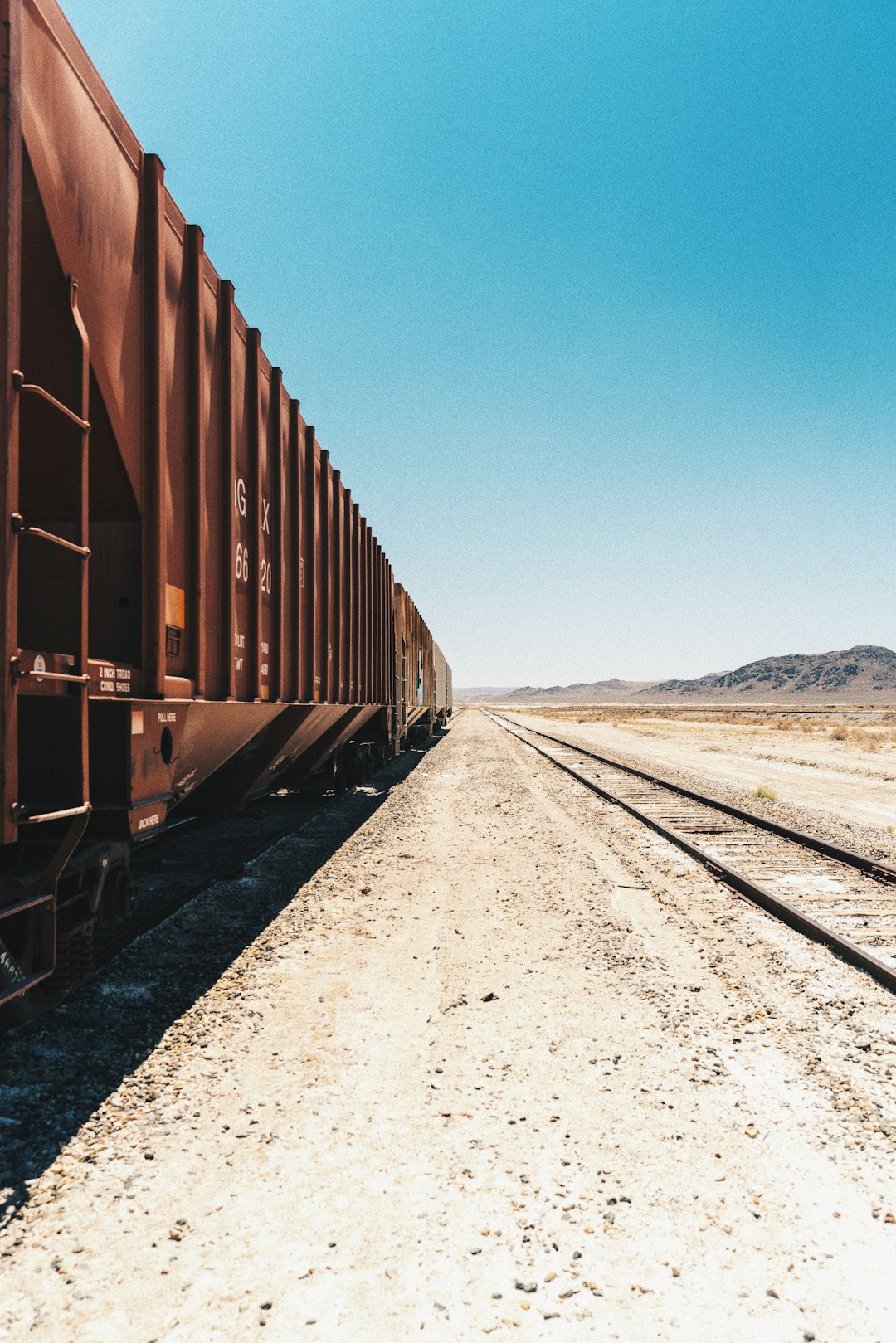 brown train on rail during daytime