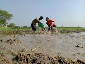 Volunteers and staff working together to install clean water facilities in a rural village.