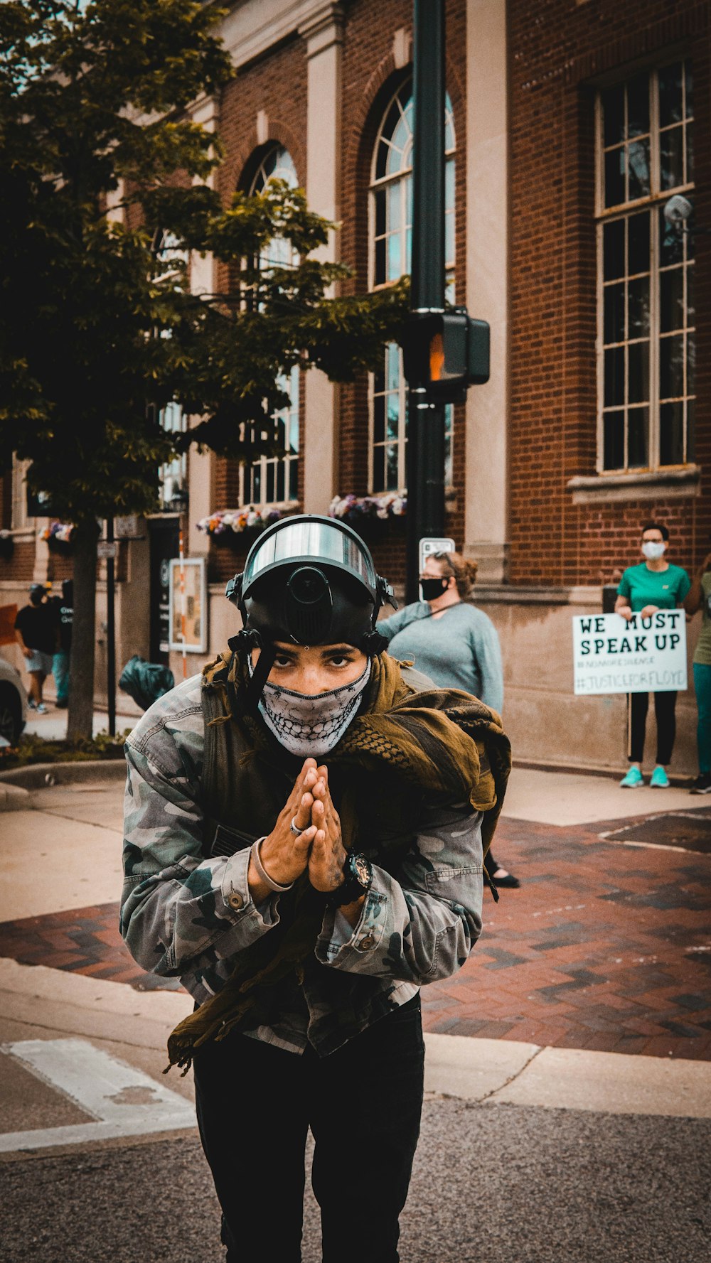 man in gray jacket wearing black helmet