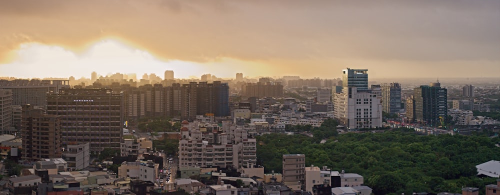 city skyline under orange sky during sunset