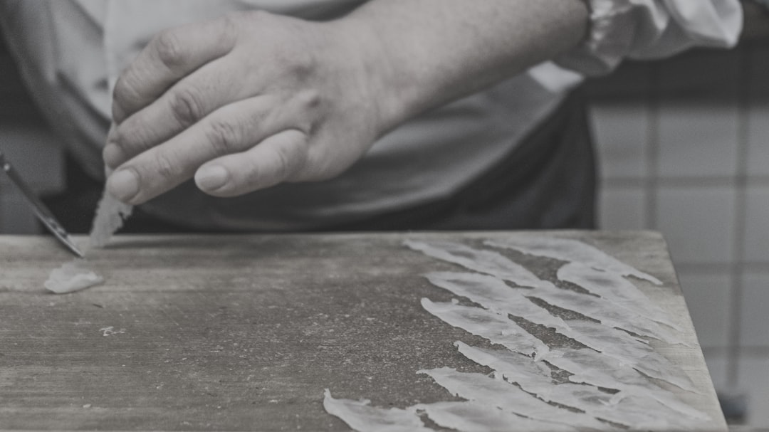 person holding white and blue textile, Fugu restauran