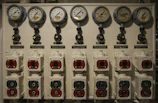 Modern laboratory environment showing pressure instruments and digital displays.