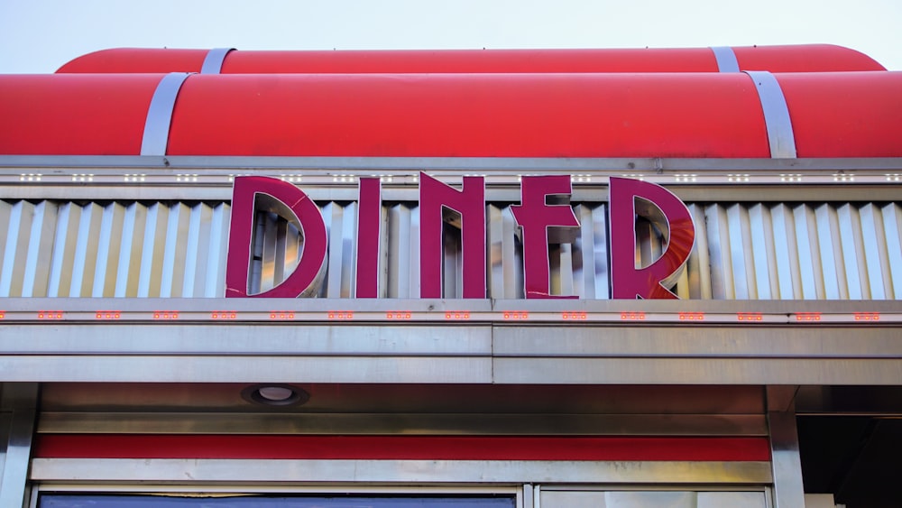 a sign that says diner on the side of a building