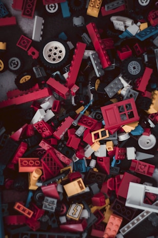 An assortment of colorful LEGO bricks in various shapes.