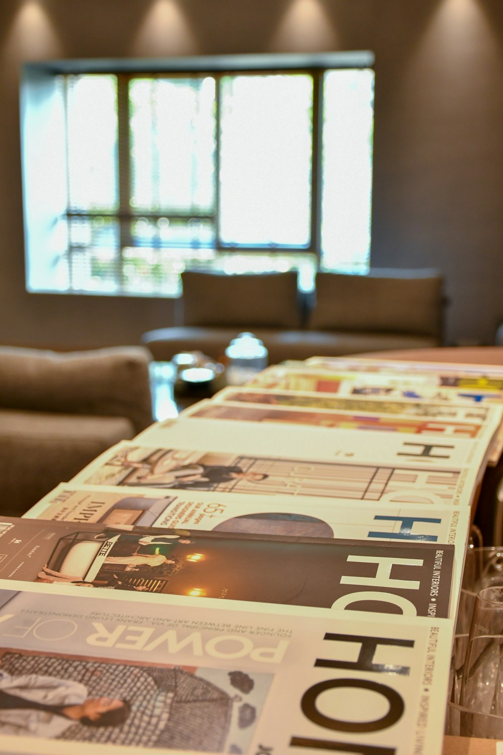 white and brown magazine on brown wooden table