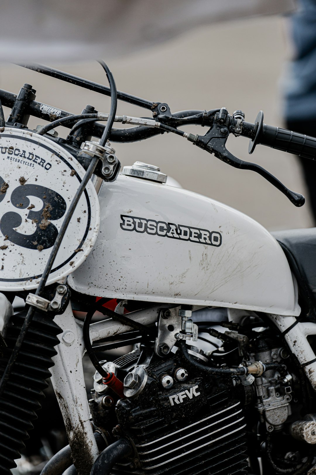 white and black motorcycle with white and black round analog clock