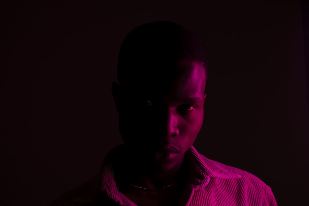 man in red and white striped collared shirt