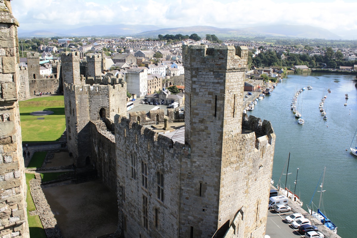 Caernarfon Castle on the waterfront in Gwynedd, north-west Wales
