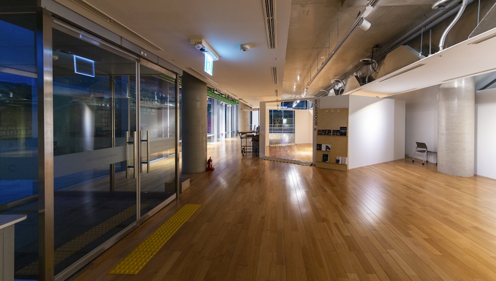 brown wooden floor with white wall