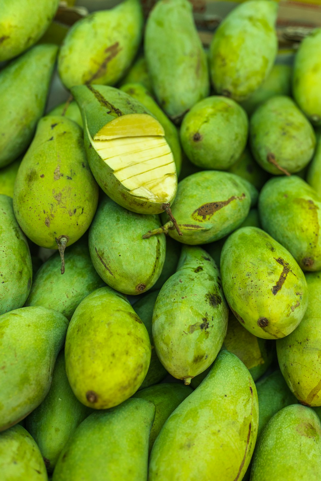 green fruits on green round fruit