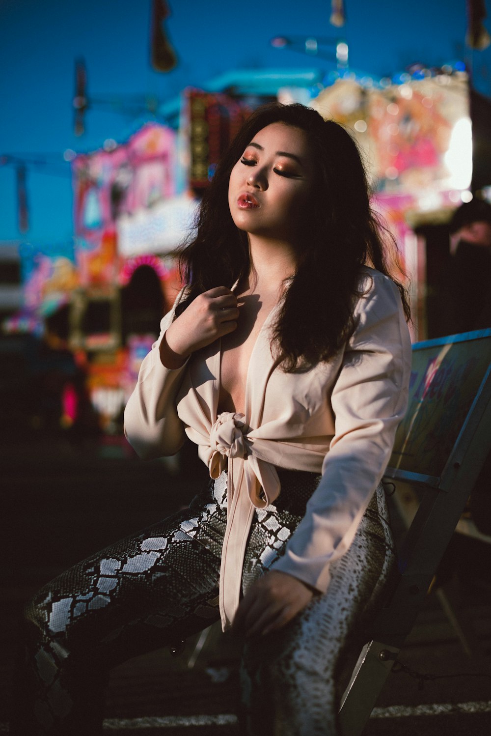 woman in white long sleeve shirt sitting on bench