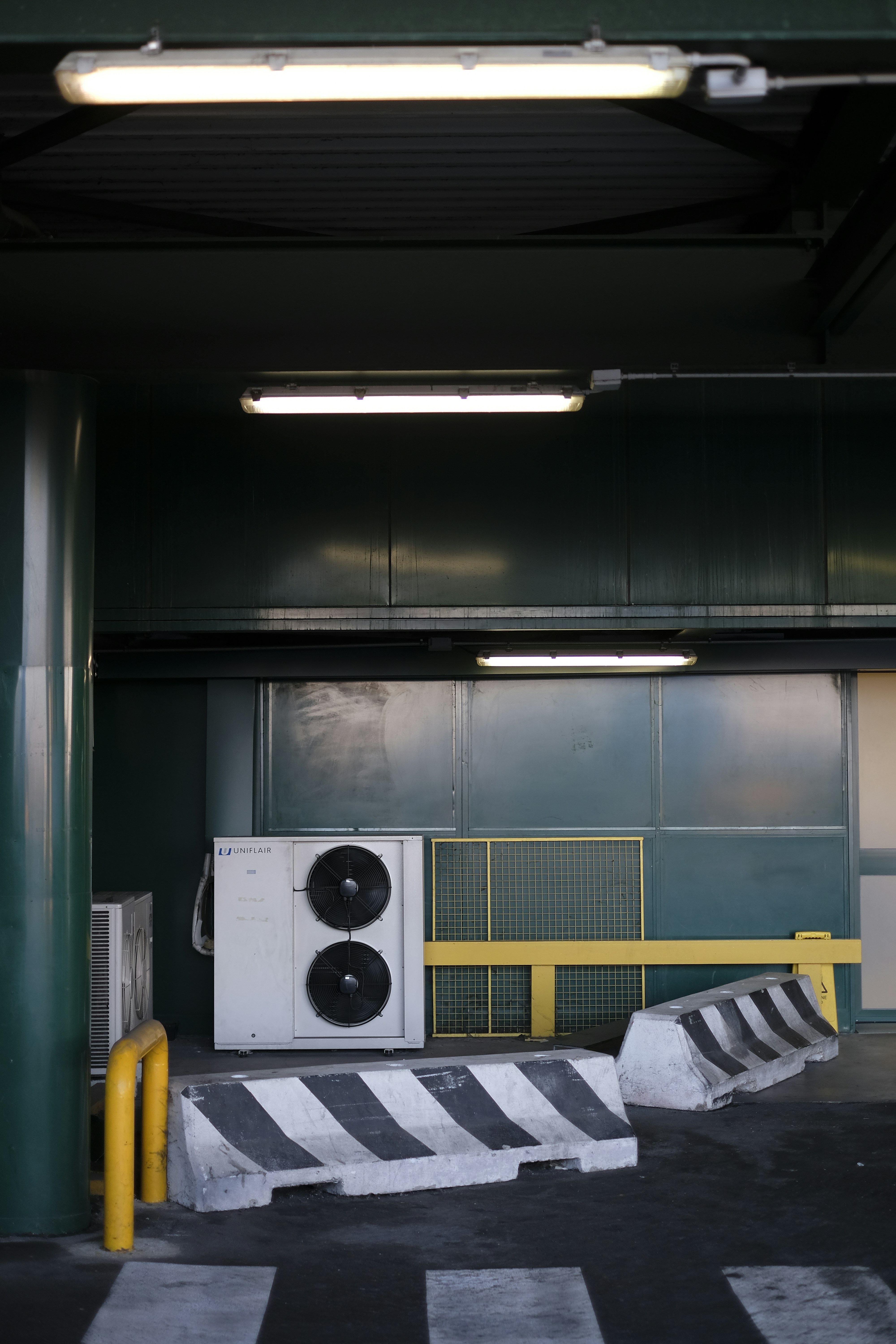 A dilapidated garage using fluorescent lamps