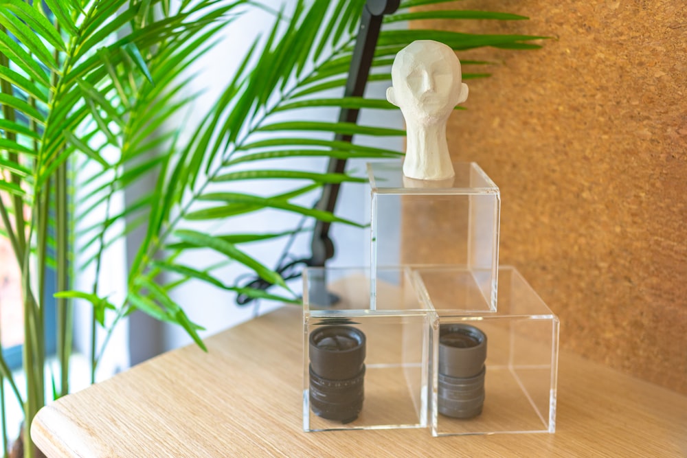 2 clear glass condiment shakers on brown wooden table