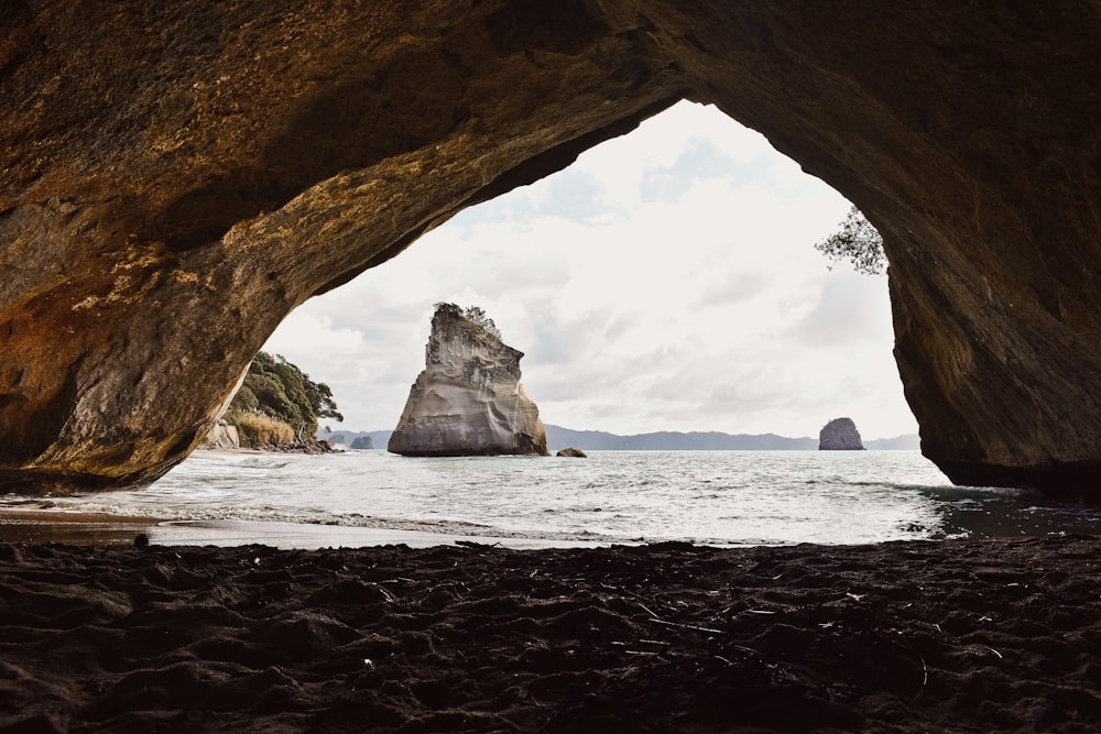 brown rock formation on sea shore during daytime