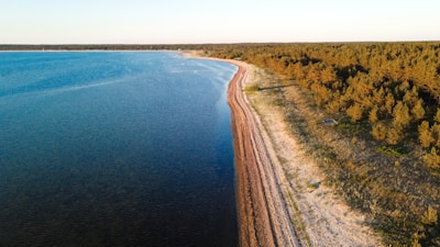 A stunning aerial view of a pristine coastline with clear blue waters.