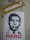 A stencil-style poster of a man's face is displayed on a wall. Below the image, the word 'HERO' is written in bold red letters. Above the poster, there is a sticker with a leopard print background and the word 'OVERKILL' in bold white letters.