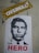 A stencil-style poster of a man's face is displayed on a wall. Below the image, the word 'HERO' is written in bold red letters. Above the poster, there is a sticker with a leopard print background and the word 'OVERKILL' in bold white letters.