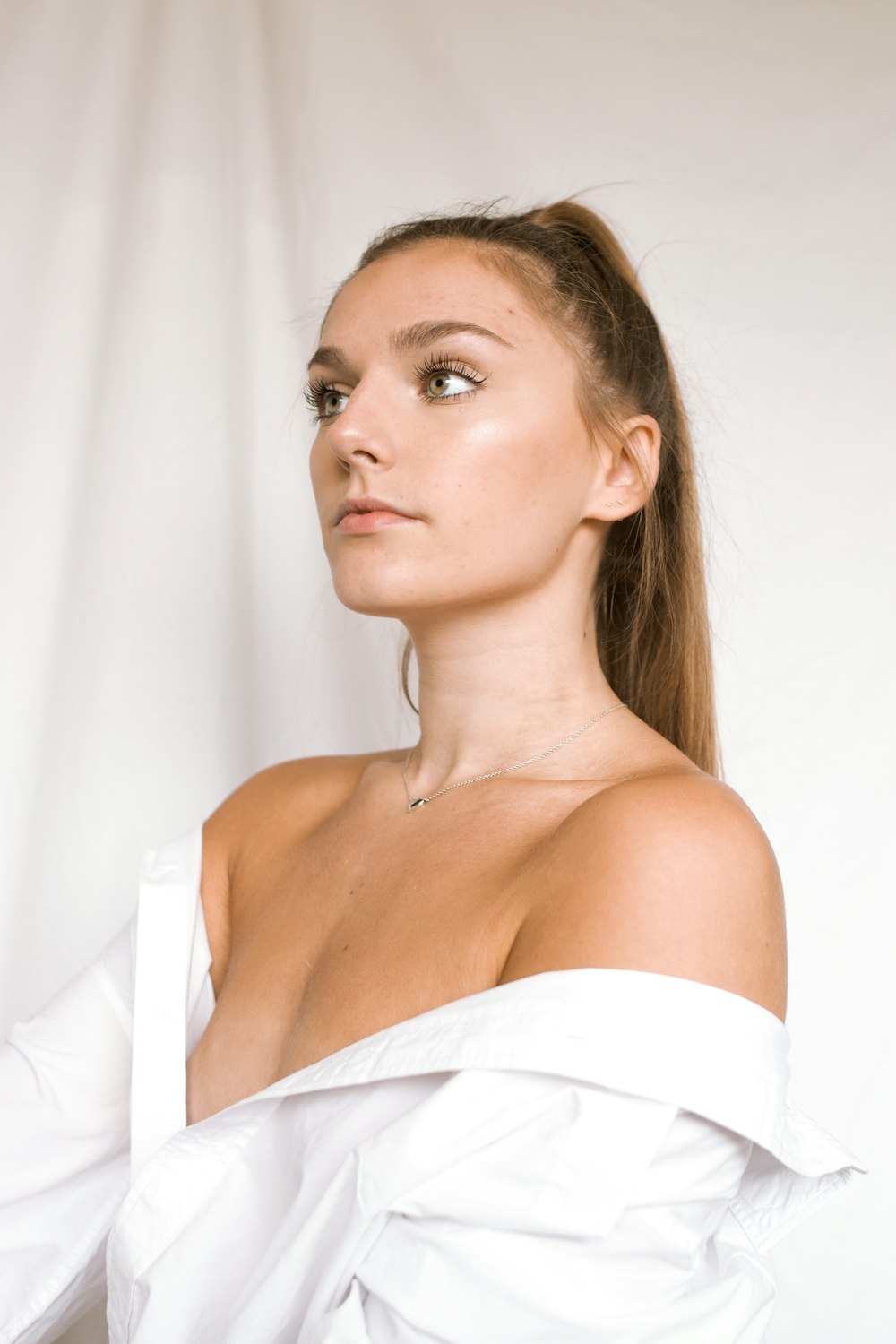 woman in white off shoulder shirt