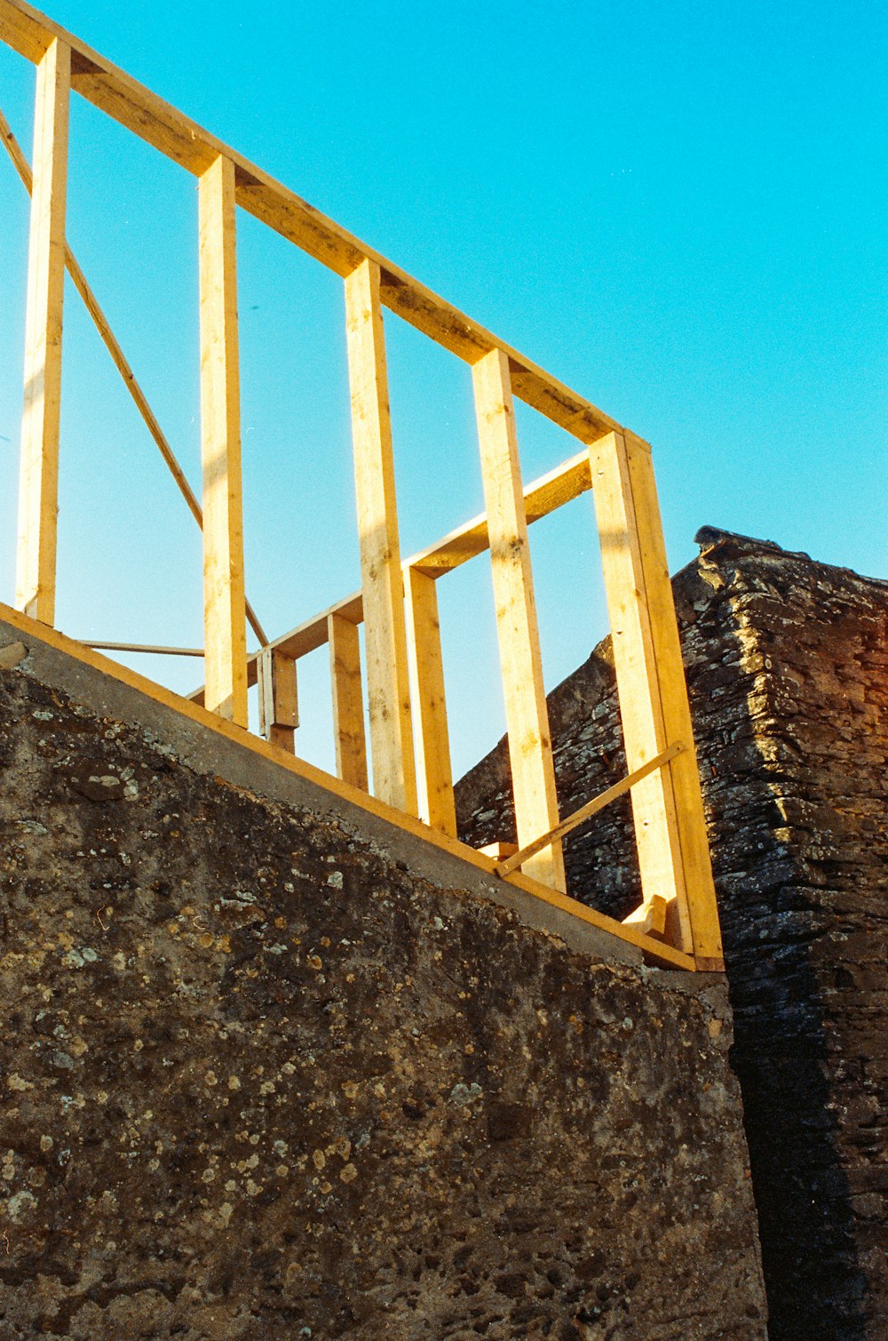 white metal ladder on gray concrete wall