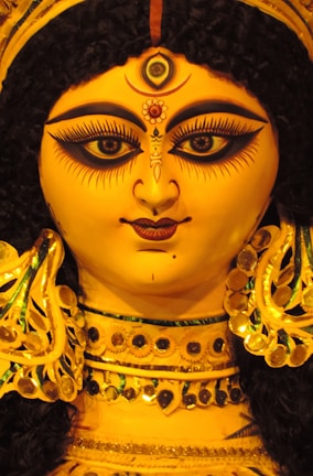 Close-up of a vibrant spiritual artwork created from hair strands and skin textures.