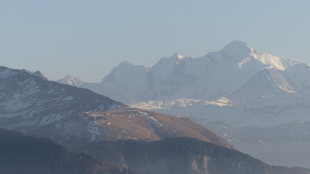 brown and black mountains under blue sky during daytime