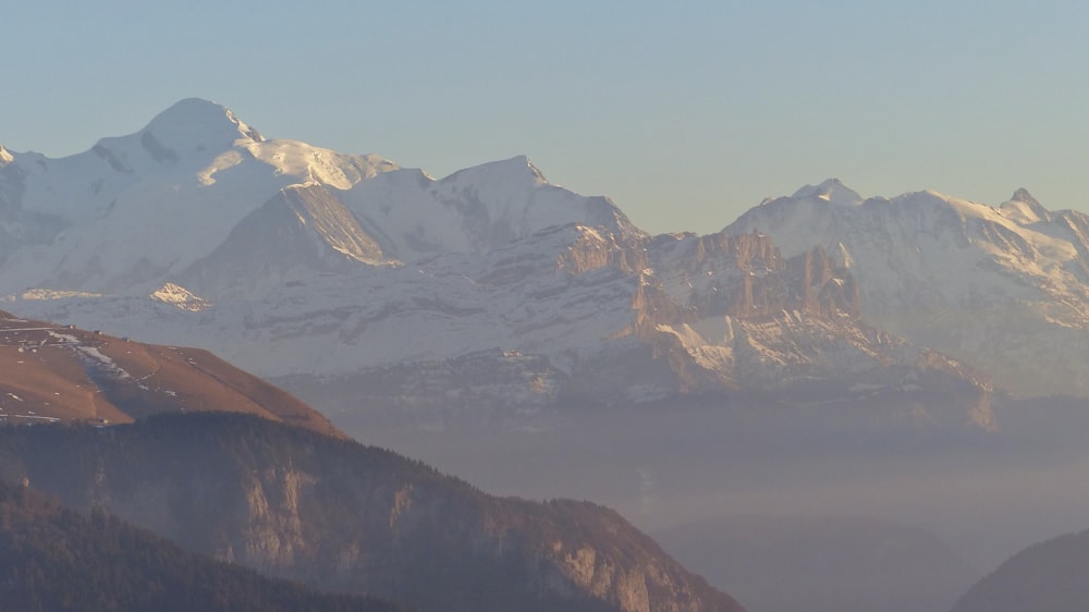 brown and white mountains under blue sky during daytime