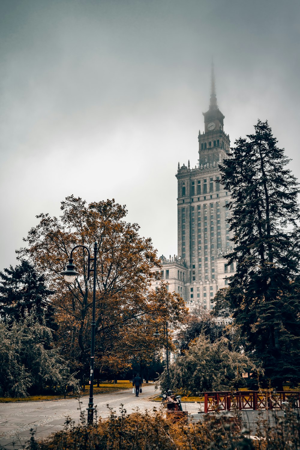 white concrete building near trees during daytime