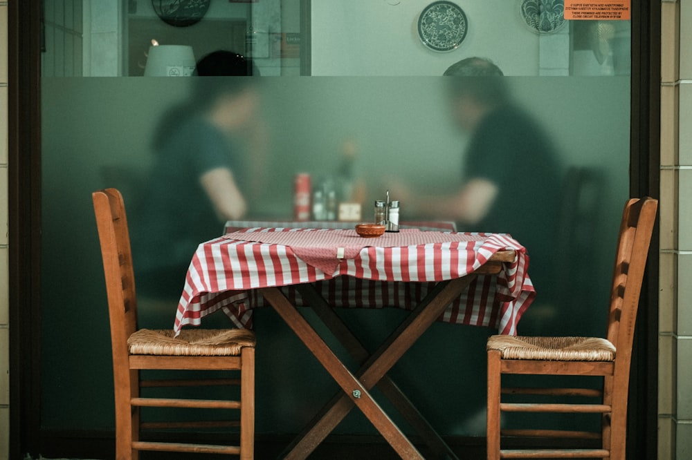 red and white checkered table cloth on brown wooden table