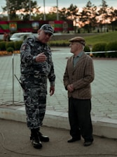 Friendly financial advisor discussing loan options with a senior police retiree.