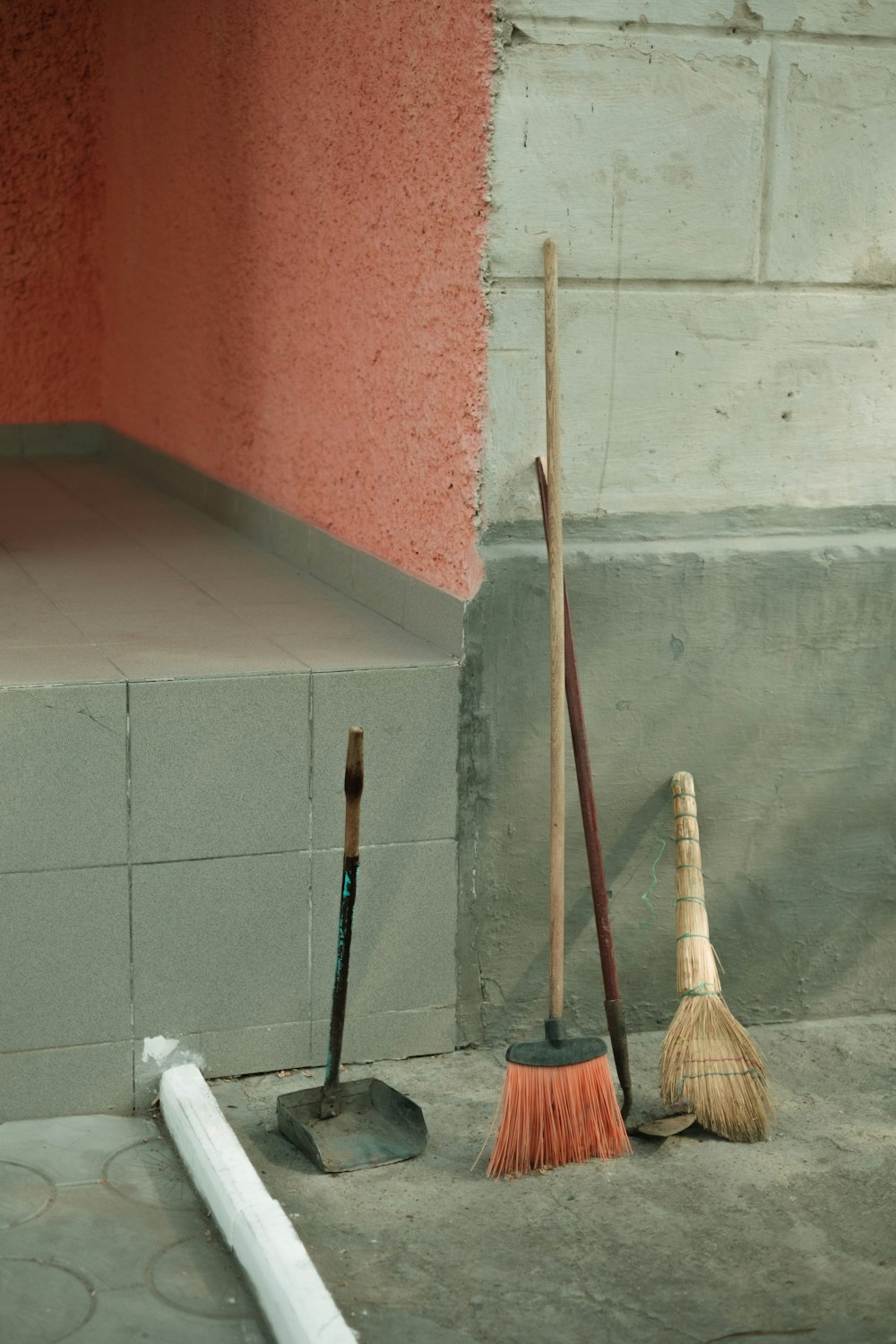 brown broom stick beside white plastic bag