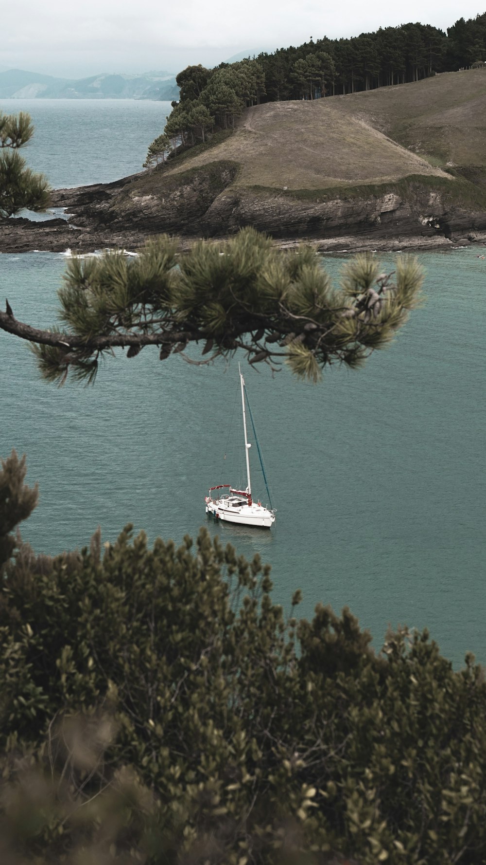 white boat on blue sea during daytime