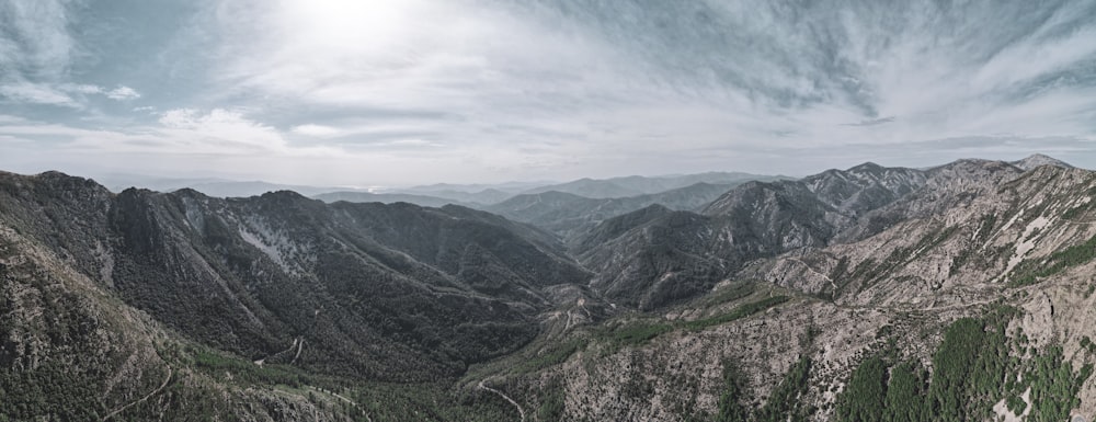 green mountains under white clouds during daytime