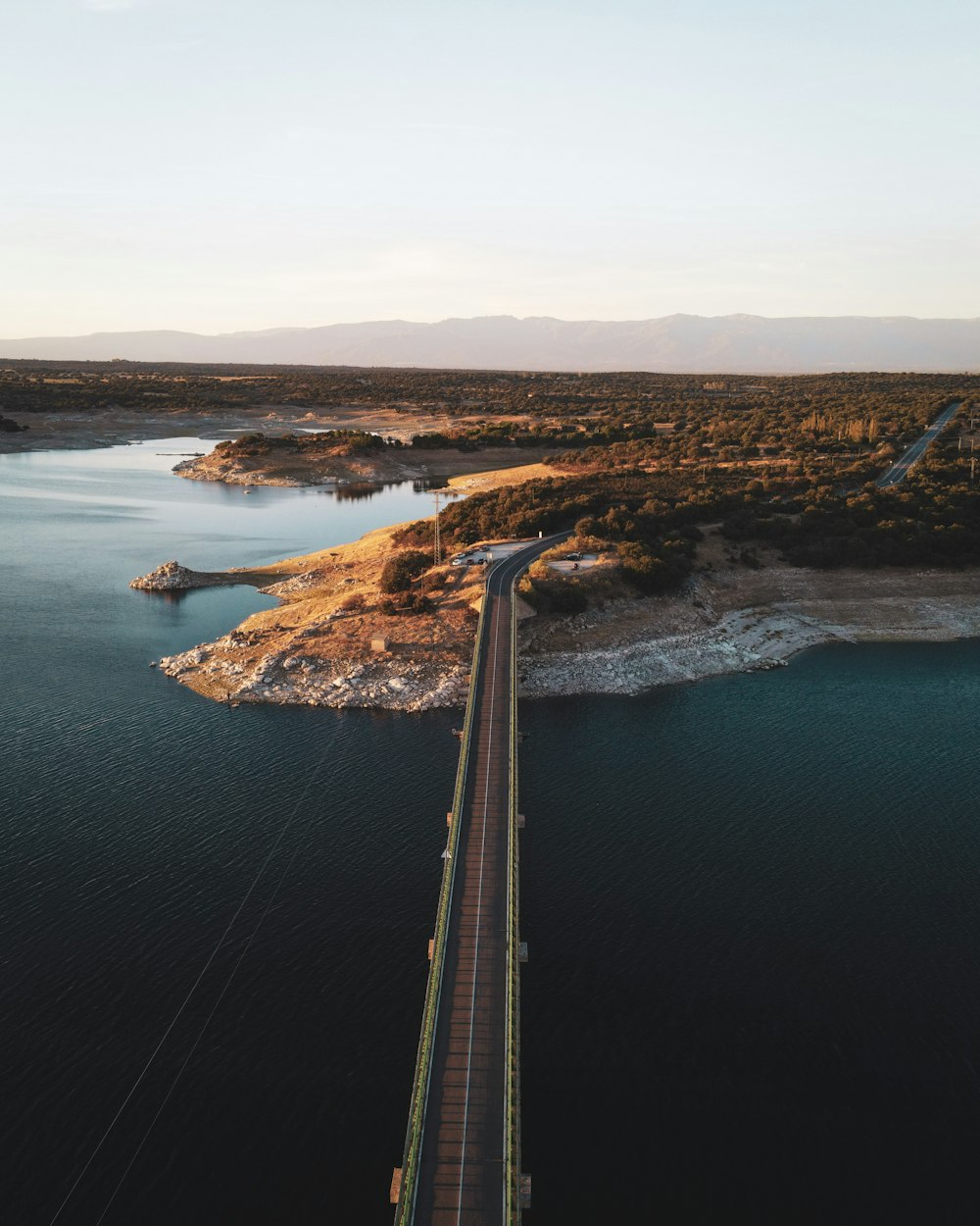 aerial view of bridge over river during daytime