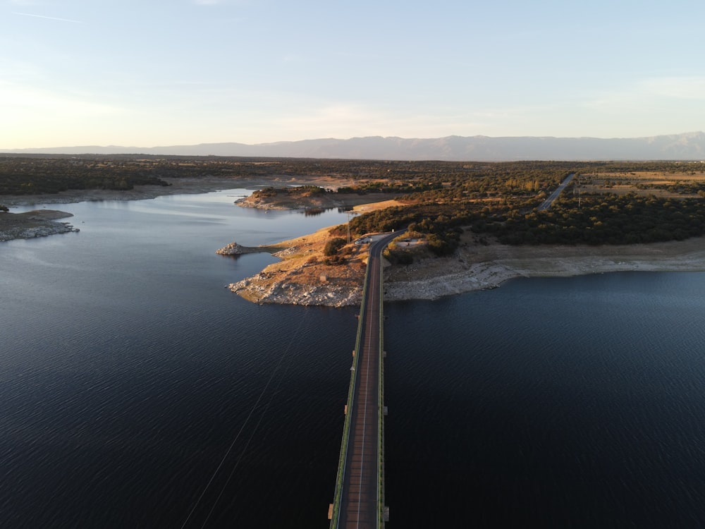 aerial view of bridge over river during daytime